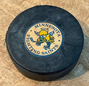 lot 173 image: Minnesota Fighting Saints Vintage Oficial Leage Hockey Puck