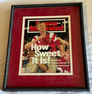 lot 195 image: Tom Osborne Signed and Framed Sports Illustrated Magazine - Nebraska Football