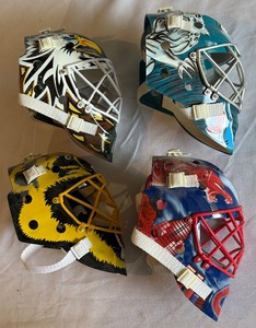 lot 211 image: (4) Vintage Hockey Goalie Helmets