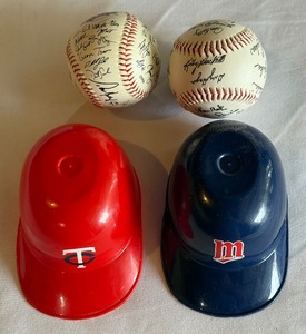 lot 220 image: Minnesota Twins (2) Mini Helmets and (2) Stamped Team Baseballs