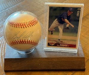 lot 19A image: Brad Radke Signed Baseball and Card Display Rawlings OALB Budig  BallMinnesota Twins