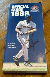 lot 21A image: Carlos Delgafo Signed Toronto Blue Jays 1999 Official Baseball Guide