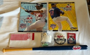 lot 245 image: Lot of Minnesota Twins Memorabilia - 2004 Division Series Programs, Homer Hankie, Minibat, Mini Bobblehead, 1991 Button