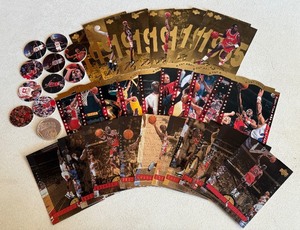 lot 16B image: Michael Jordan Multiple Card Sets, Pogs, and Coin - Gatorafe, A Cut Above, Greater Heights Basketball Cards