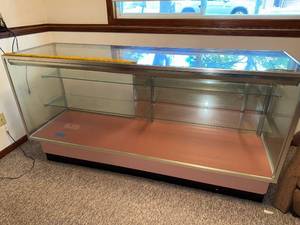 lot 83 image: Glass Display Case Counter with Shelves and Sliding Doors