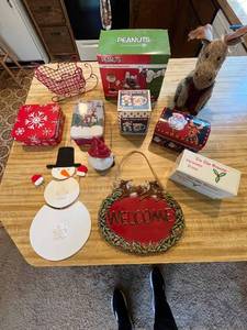 lot 39 image: Christmas Decor Lot Including Peanuts Light Set, Snowman Plates, Tins, and More