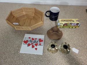 lot 52 image: Assorted Home Decor and Collectibles Lot Including Basket, Mug, Candlestick Holders, Tile, Sculpture, and Dog Treats