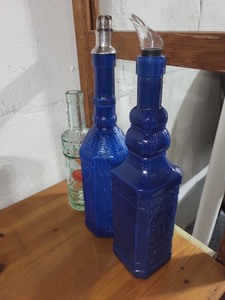 lot 114 image: Set of 3 Decorative Glass Bottles with Blue and Clear Designs