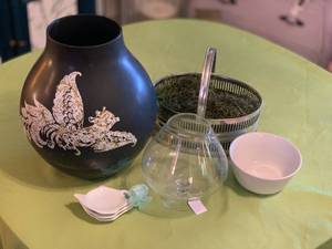 lot 168 image: Decorative Home Decor Collection with Black Vase, Glass Brandy Snifter, Metal Basket, and Bowls