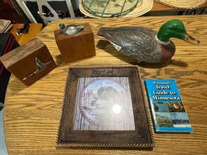 lot 65 image: Duck Collectibles Set with Carved Decoy, Art, Bookends, and Minnesota Guide