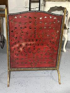 lot 10 image: Vintage Pierced Red Fireplace Screen with Brass Frame