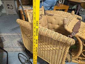 lot 89 image: Vintage Wicker Baby Carriage with Intricate Weaving