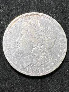 lot 21 image: 1883-O US MORGAN SILVER DOLLAR