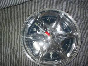 lot 72 image: Vehicle rim battery operated clock ...