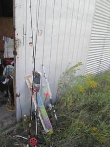 lot 96 image: New and used fishing poles, some wi...
