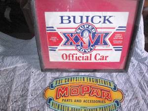 lot 199 image: Buick and Mopar wall decor...