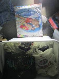 lot 297 image: Storage tote full of mens XL t-shi...