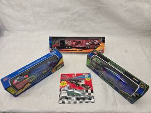 lot 10 image: (3) 164 Scale Nascar Transporters and (1) Mini Transporter