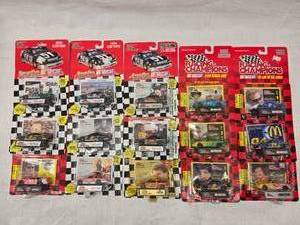 (15) 1/64 Scale Nascar Collectables Cars with Trading Card and Display Stand 93-97