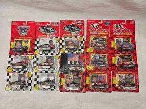 lot 14 image: (15) 164 Scale Nascar Collectables Cars with Trading Card and Display Stand