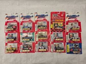 lot 18 image: (15) Nascar Super Turck Collectables with Trading cars and stand