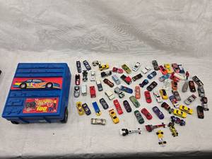 lot 23 image: Hot Wheels Rolling Storage Case and Misc. Hot Wheel and Matchbox Cars