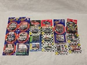 lot 30 image: (18) 164 Scale Nascar Collectables with Display Stand and Trading Cards