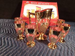 lot 30 image: Gold and rose color pitcher with 6 glasses in original box