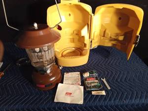lot 89 image: 1983 Colemon brown with manual and accessories