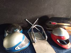 lot 100 image: 3 Helmets, 1 Bates Salbe bag, 4 way metric lug wrench, 1 motorcycle parking rack