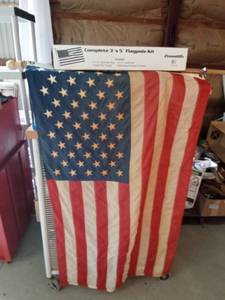 lot 111 image: 2 American flags (1 in a box and 1 on a pole)