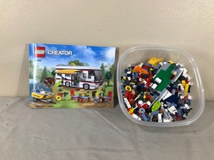 lot 397 image: Container of Legos with Lego Book