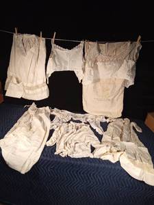 lot 173 image: Vintage bras, dresses, shirt & skirt, flour sack