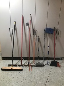 lot 339 image: Shop broom, metal beach rake, extension poles, broom and more