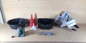 lot 285 image: oil pan, funnels, yard trailer hitch, 2 dock wenches and more
