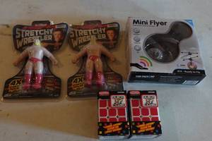 lot 381 image: Assorted Toys - Stretchy Wrestlers, Drone, Quick Cubes