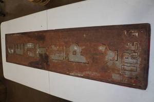 lot 12 image: Century Tires Embossed Metal Sign