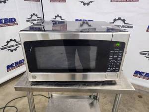 lot 7 image: GE Countertop Microwave Oven - New, Scratch and Dent