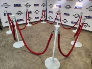 lot 15 image: Set of 8 White Crowd Control Stanchions with Red Velvet Ropes