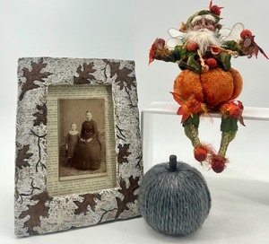 lot 41 image: Fall Decor Set Fairy Figurine, Yarn Pumpkin, and Leaf Embellished Picture Frame