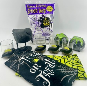 lot 43 image: Halloween Decor Bundle with Raven Candle Holders, Towels, Spider Web, and Props