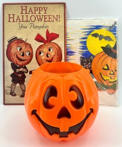 lot 47 image: Vintage Halloween Pumpkin Pail, Vintage Style Metal Sign, and Vintage Festive Tablecloth Set