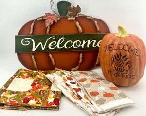 lot 57 image: Fall Pumpkin Welcome Decor Set with Signs, Towels, and Table Runner