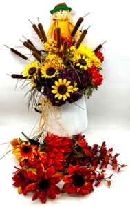lot 75 image: Fall Artificial Floral Arrangement with Sunflowers and Scarecrow in Vintage Enamel Pitcher
