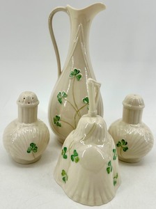 lot 123 image: Belleek Ireland Porcelain Harp Shamrock Pitcher, Bell, and Salt & Pepper Set