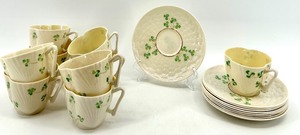 lot 132 image: Belleek Ireland Harp Shamrock Cup and Basketweave Saucer Set, 9 Cups and 9 Saucers