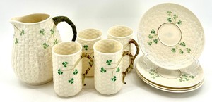 lot 136 image: Belleek Basketweave Shamrock Porcelain Pitcher, 4 Mugs and 4 Saucers Set