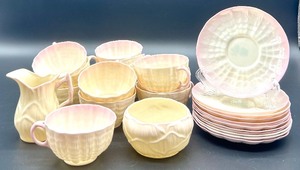 lot 142 image: Belleek Lotus Pattern Irish Porcelain Tea Set with Cups, Plates, Creamer, and Sugar Bowl
