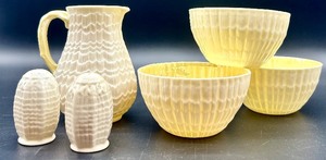 lot 146 image: Belleek Tridacna Milk Pitcher, Three Bowls, and Salt & Pepper Shakers Set