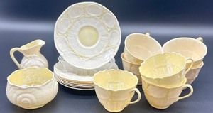 lot 148 image: Belleek Ireland Neptune Shell and Toy Shell Porcelain Tea Set with Cups, Saucers, Creamer, and Sugar Bowl